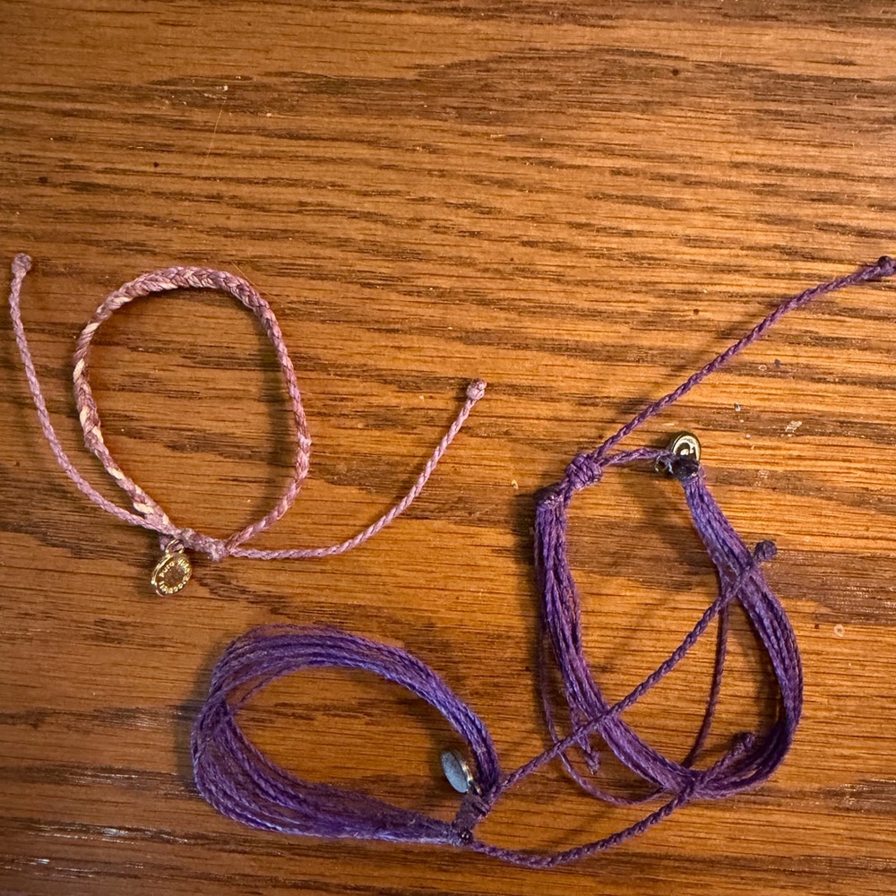 Pura Vida purple and multi color stackable string bracelets